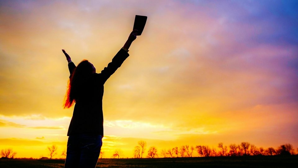 october-2016-prayer-calendar-cover-photo-woman-worshipping-with-sunset
